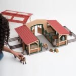 Schleich Horse Barn and Stable Playset - Award-Winning Riding Center 96 Piece Set, 2 Pony Toys, Rider Figurine, and Farm Accessories, for Girls and Boys 3 Years Old and Above - Image 3